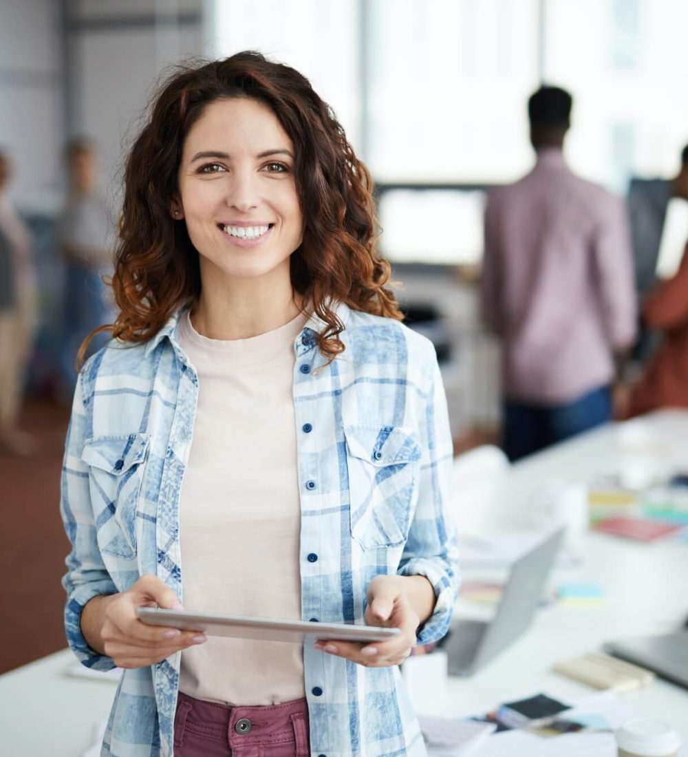 cheerful-young-woman-posing-in-creative-agency-1.jpg